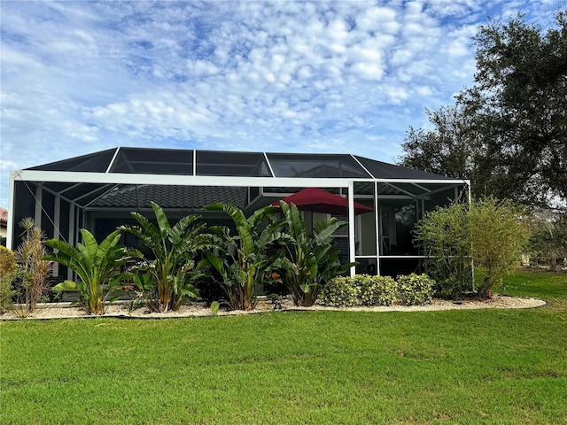 5101 Pine Shadow Ln, North Port, FL 34287 - back of property with a lawn and glass enclosure