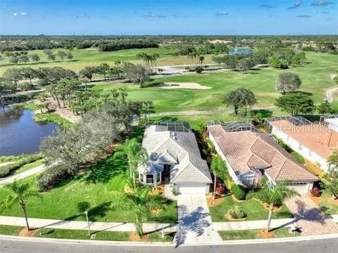 5101 Pine Shadow Ln, North Port, FL 34287 - aerial view of property and surrounding area featuring a golf club and a nearby body of water