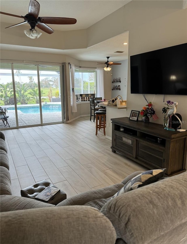 5101 Pine Shadow Ln, North Port, FL 34287 - living area with ceiling fan and baseboards