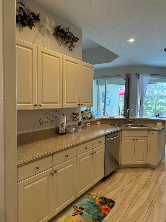 5101 Pine Shadow Ln, North Port, FL 34287 - kitchen featuring dishwasher, a sink, white cabinets, recessed lighting, and light countertops