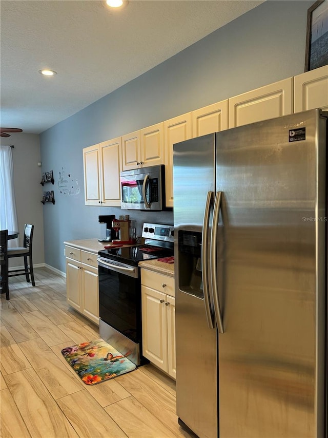 5101 Pine Shadow Ln, North Port, FL 34287 - kitchen with stainless steel appliances, light countertops, light wood-type flooring, recessed lighting, and a ceiling fan