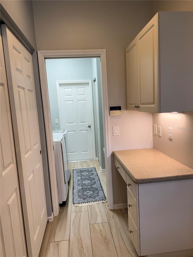 5101 Pine Shadow Ln, North Port, FL 34287 - washroom featuring washer and dryer, light marble finish flooring, and baseboards