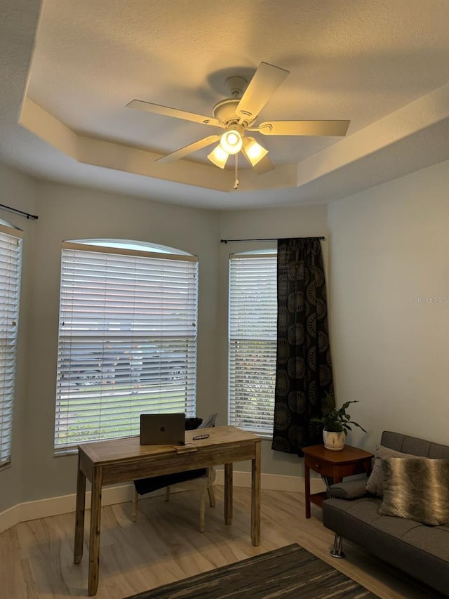 5101 Pine Shadow Ln, North Port, FL 34287 - home office featuring a ceiling fan, baseboards, and light wood-style flooring