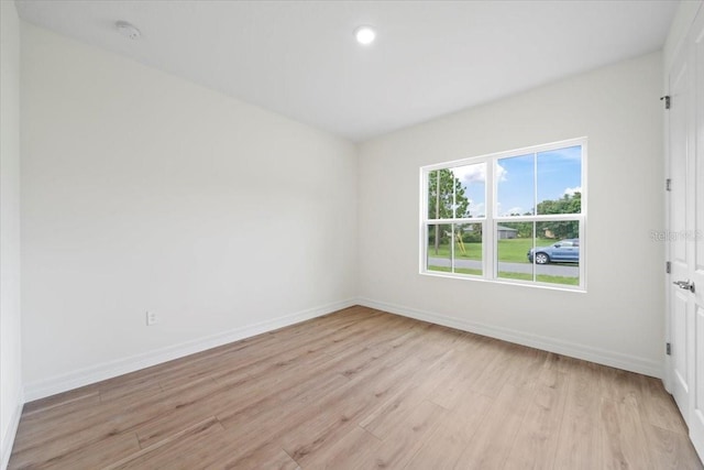 unfurnished room with light hardwood / wood-style floors