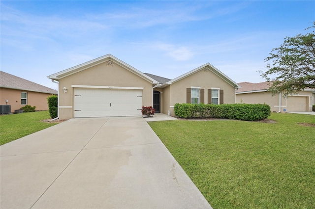 ranch-style house with central air condition unit, a garage, and a front yard