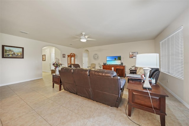 living room with ceiling fan and light tile patterned floors