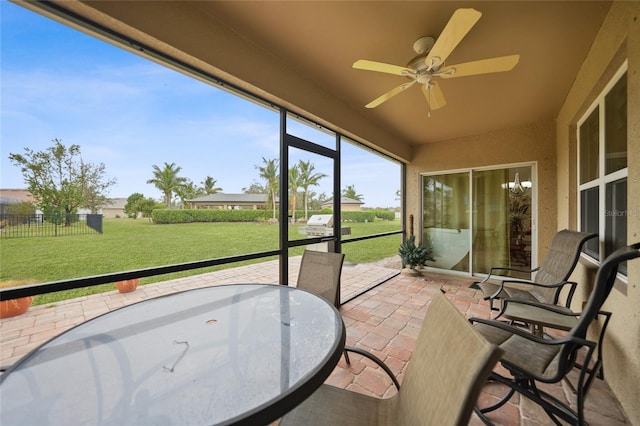 sunroom / solarium with ceiling fan