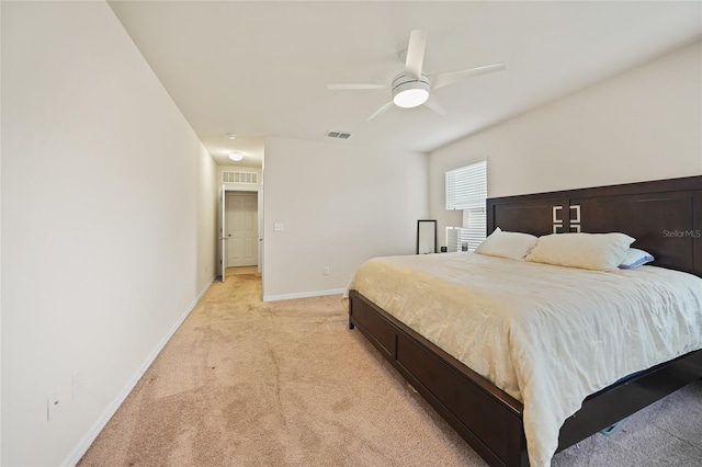 bedroom with light carpet and ceiling fan