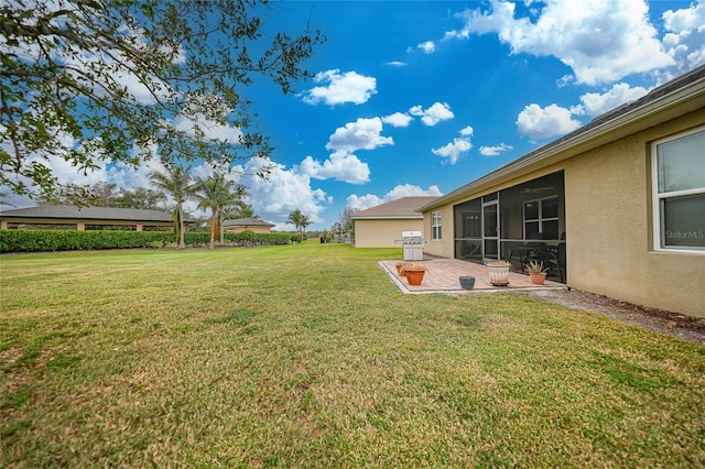 view of yard with a patio and a sunroom