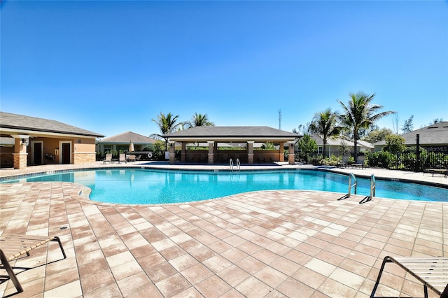 view of swimming pool featuring a patio area and a gazebo