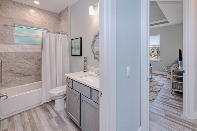 1450 Kiwi Ct, Punta Gorda, FL 33950 - full bathroom with healthy amount of natural light, wood finished floors, toilet, and vanity