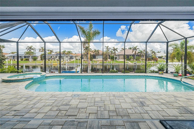 view of pool featuring a patio area, a water view, an in ground hot tub, and a lanai