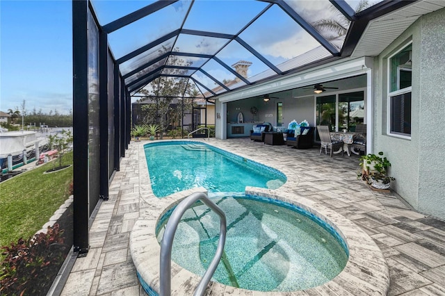 1450 Kiwi Ct, Punta Gorda, FL 33950 - view of swimming pool with a patio, outdoor lounge area, ceiling fan, a pool with connected hot tub, and glass enclosure