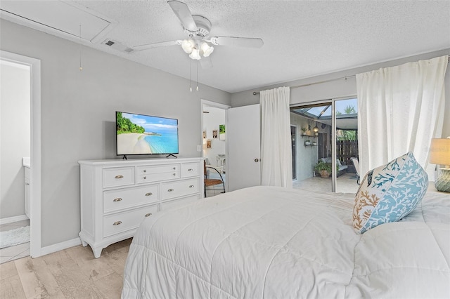 bedroom with a textured ceiling, access to outside, light hardwood / wood-style flooring, and ceiling fan