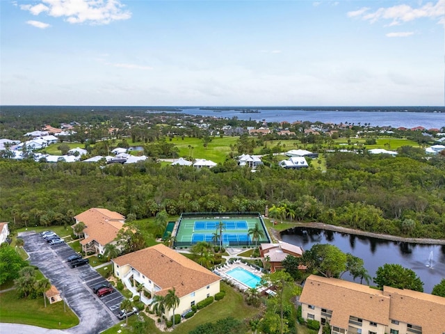 birds eye view of property with a water view