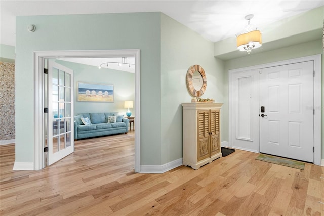 268 Lewis Cir Unit 132, Punta Gorda, FL 33950 - entrance foyer featuring wood finished floors and a chandelier