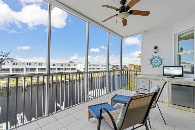 sunroom / solarium with a wealth of natural light and ceiling fan