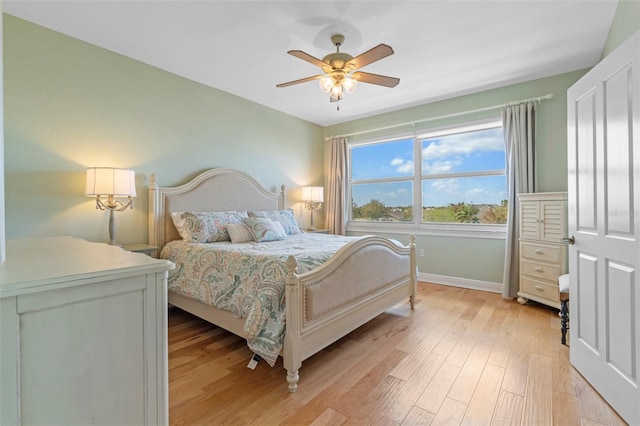 bedroom with light wood-type flooring and ceiling fan