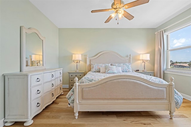 bedroom with light hardwood / wood-style floors and ceiling fan