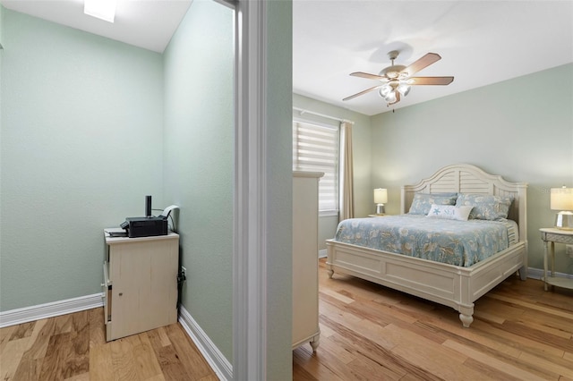 bedroom featuring ceiling fan and light wood-type flooring