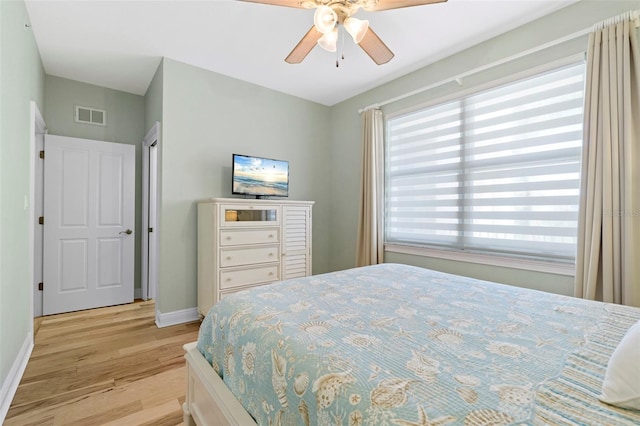 bedroom featuring light hardwood / wood-style floors and ceiling fan