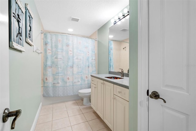 full bathroom featuring tile patterned flooring, shower / tub combo, a textured ceiling, vanity, and toilet