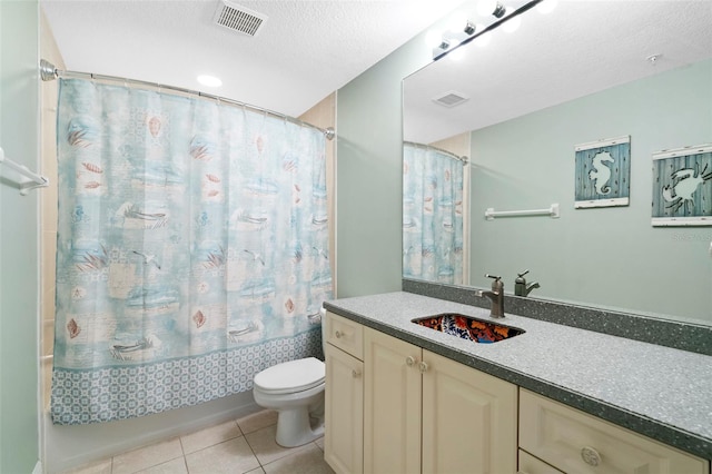 full bathroom featuring tile patterned flooring, shower / bath combination with curtain, a textured ceiling, vanity, and toilet