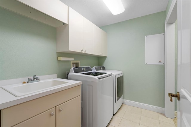 268 Lewis Cir Unit 132, Punta Gorda, FL 33950 - washroom with cabinet space, washer and dryer, and light tile patterned floors