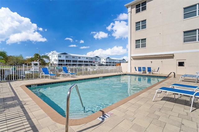 view of swimming pool featuring a patio area