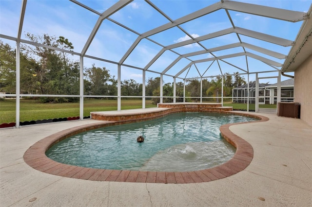 view of pool featuring a lanai and a patio area