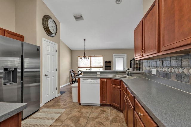 kitchen with dishwasher, stainless steel refrigerator with ice dispenser, a chandelier, tasteful backsplash, and decorative light fixtures