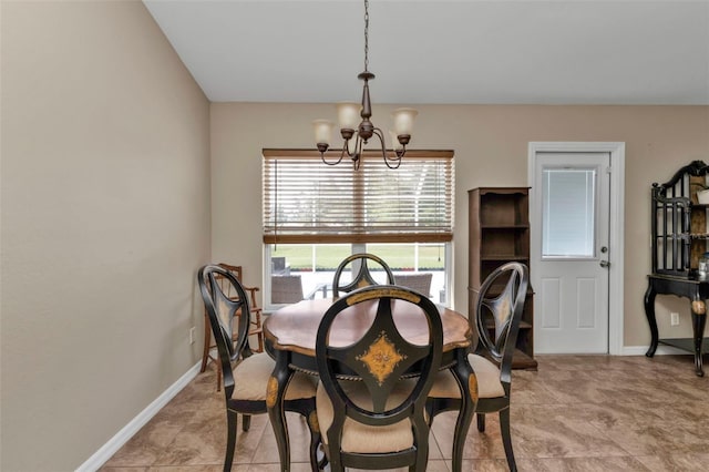 dining area featuring a notable chandelier