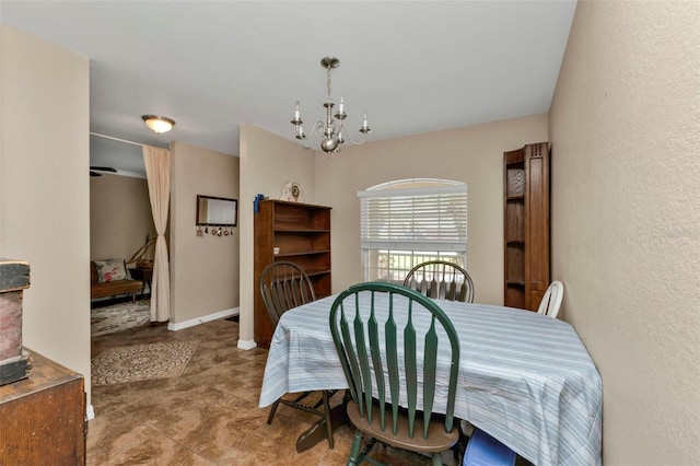 dining room with a notable chandelier