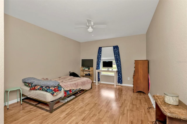 bedroom featuring ceiling fan and light hardwood / wood-style flooring