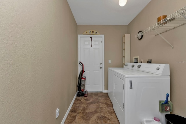 washroom with washing machine and dryer