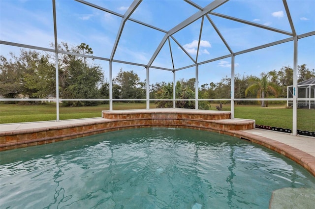 view of swimming pool featuring glass enclosure and a yard