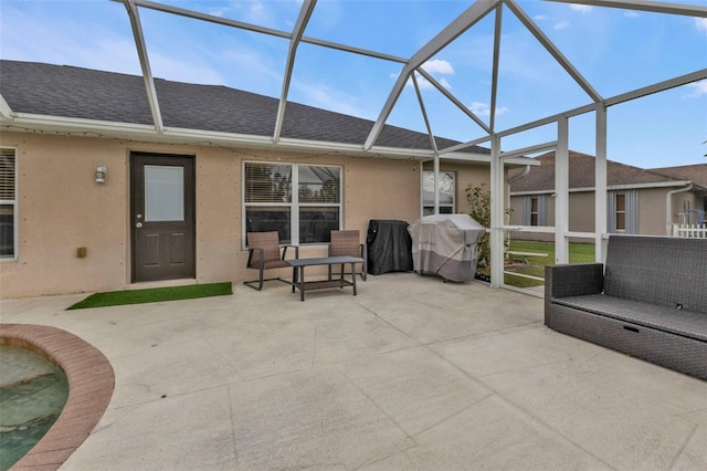 view of patio / terrace with a lanai and area for grilling