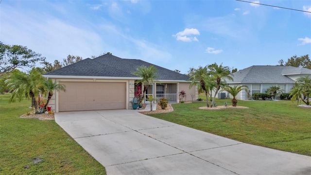 single story home with a garage and a front lawn