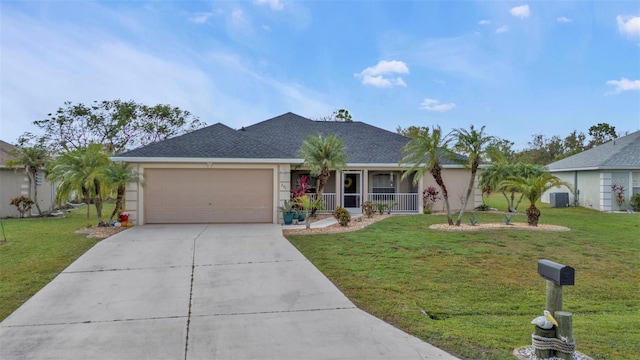 single story home with a garage, a porch, and a front yard