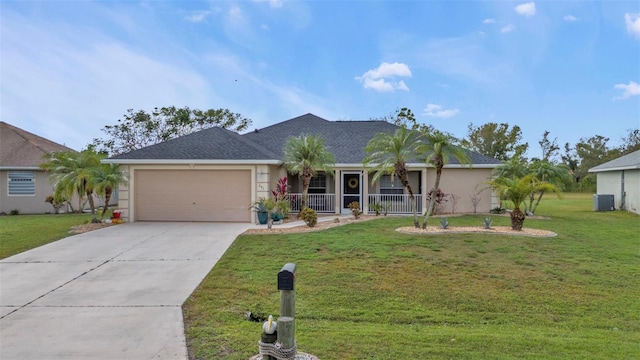 ranch-style house featuring a garage, central AC, a front yard, and covered porch