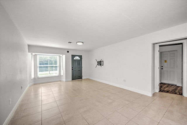 foyer with light tile patterned flooring