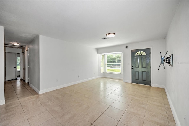 entrance foyer featuring light tile patterned floors