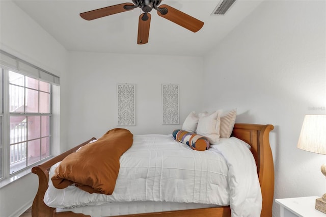 bedroom featuring hardwood / wood-style floors and ceiling fan