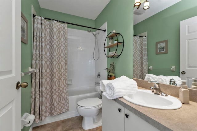 full bathroom with vanity, tile patterned floors, toilet, and shower / tub combo