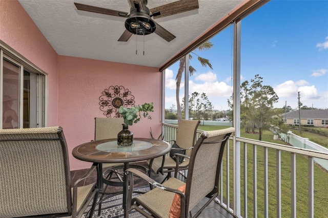 sunroom / solarium with ceiling fan