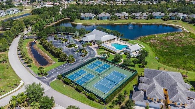 birds eye view of property with a water view