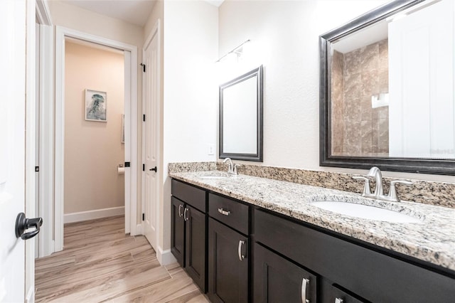 bathroom featuring vanity and hardwood / wood-style flooring