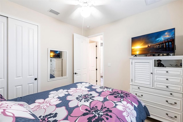 bedroom with ceiling fan and a closet