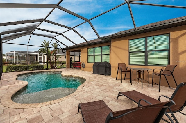 view of swimming pool with a patio, a grill, and glass enclosure