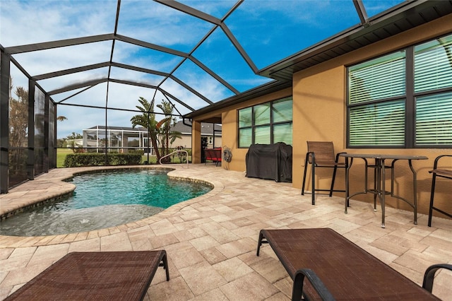 view of swimming pool featuring a patio area, a lanai, and grilling area